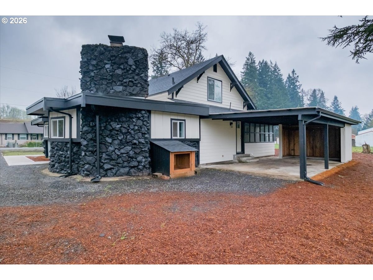 28411 Liberty Road Sweet Home, OR 97386 - Photo 9 of 48 a front view of a house with a porch