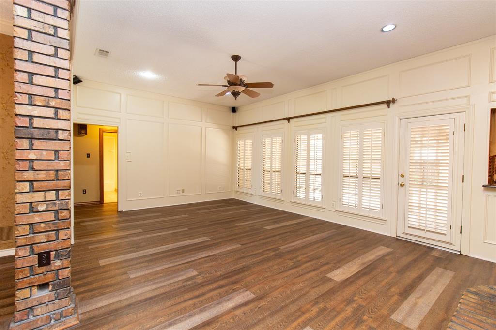 3014 Pecan Ridge Drive Rowlett, TX 75088 - Photo 3 of 29 a view of an empty room with a window and wooden floor