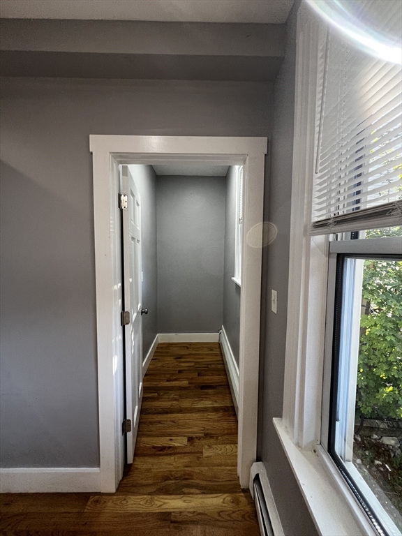 5 Sunset Street, Unit 2 Boston, MA 02120 - Photo 11 of 11 a view of a hallway with wooden floor and staircase