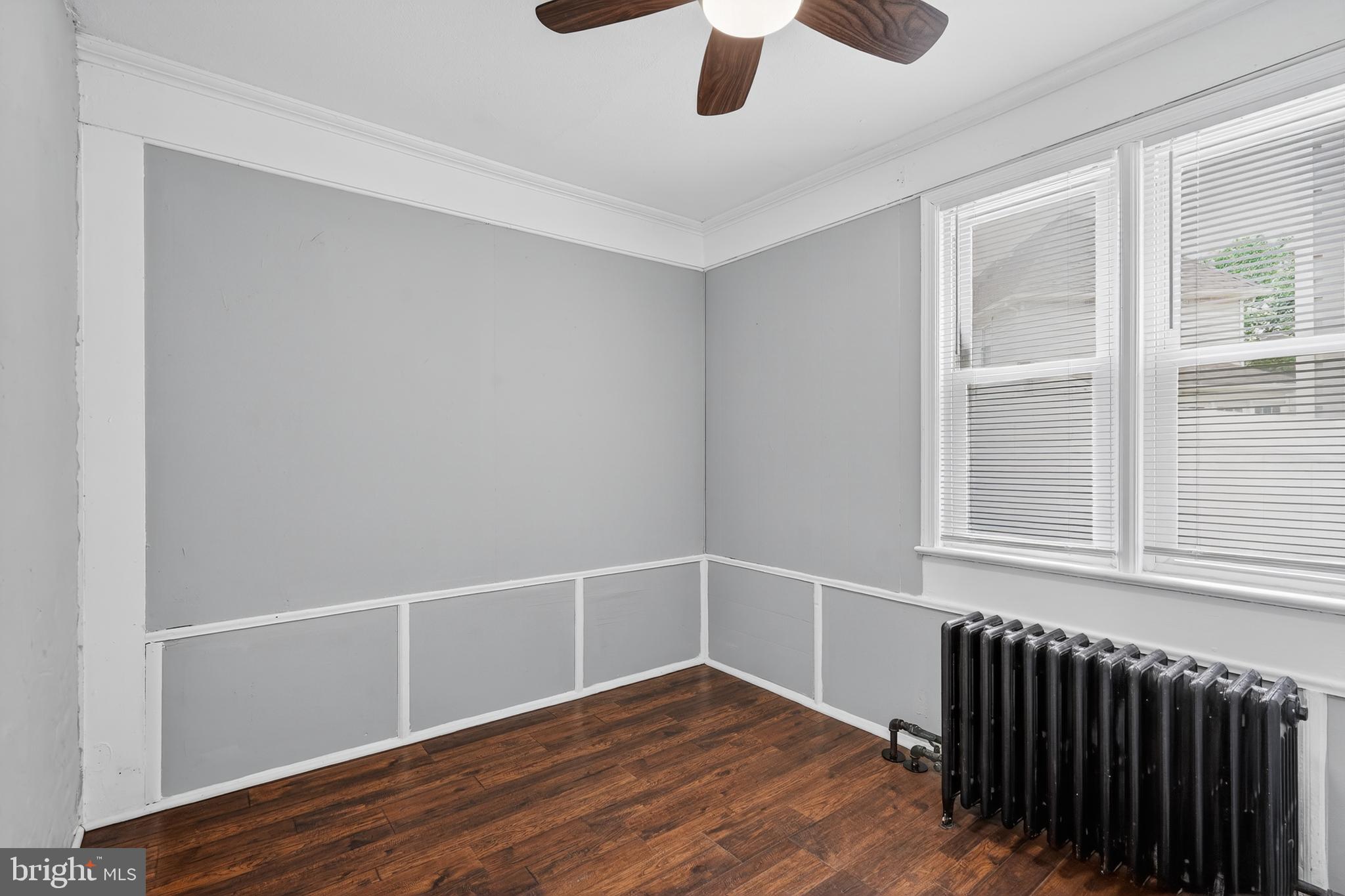 223 Noreg Place Brooklawn, NJ 08030 - Photo 7 of 36 a view of an empty room with wooden floor and a window