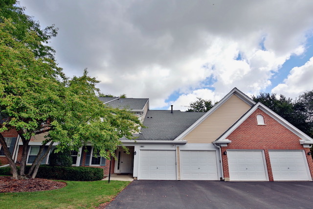 910 Persimmon Lane, Unit B Mount Prospect, IL 60056 - Photo 1 of 27 front view of house with a yard