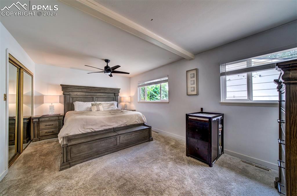 3710 Windflower Circle Colorado Springs, CO 80918 - Photo 15 of 32 a bedroom with a bed dresser and a window