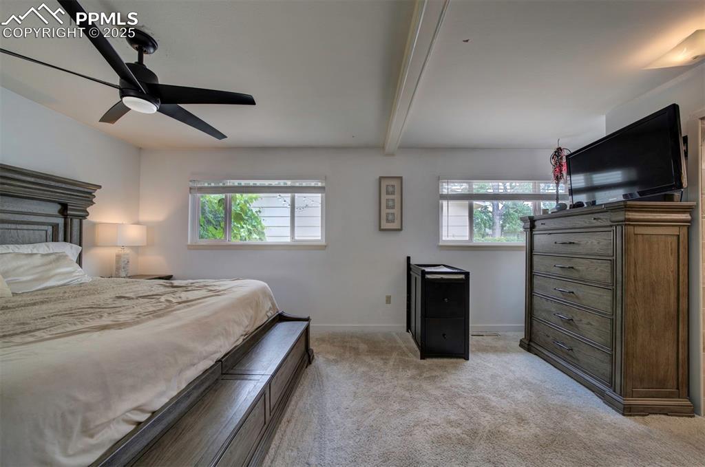 3710 Windflower Circle Colorado Springs, CO 80918 - Photo 17 of 32 a bedroom with a bed and a television
