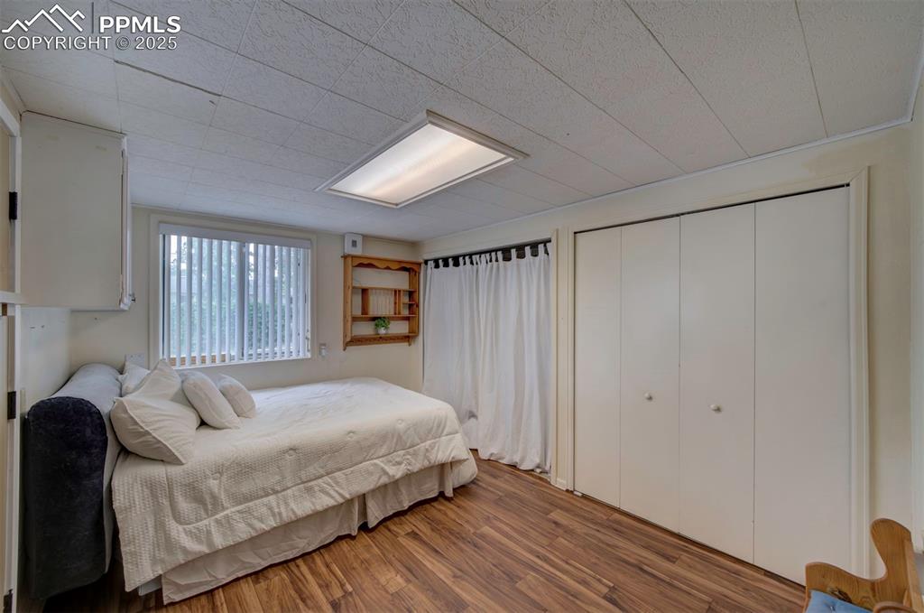 3710 Windflower Circle Colorado Springs, CO 80918 - Photo 25 of 32 a bedroom with a bed and a window