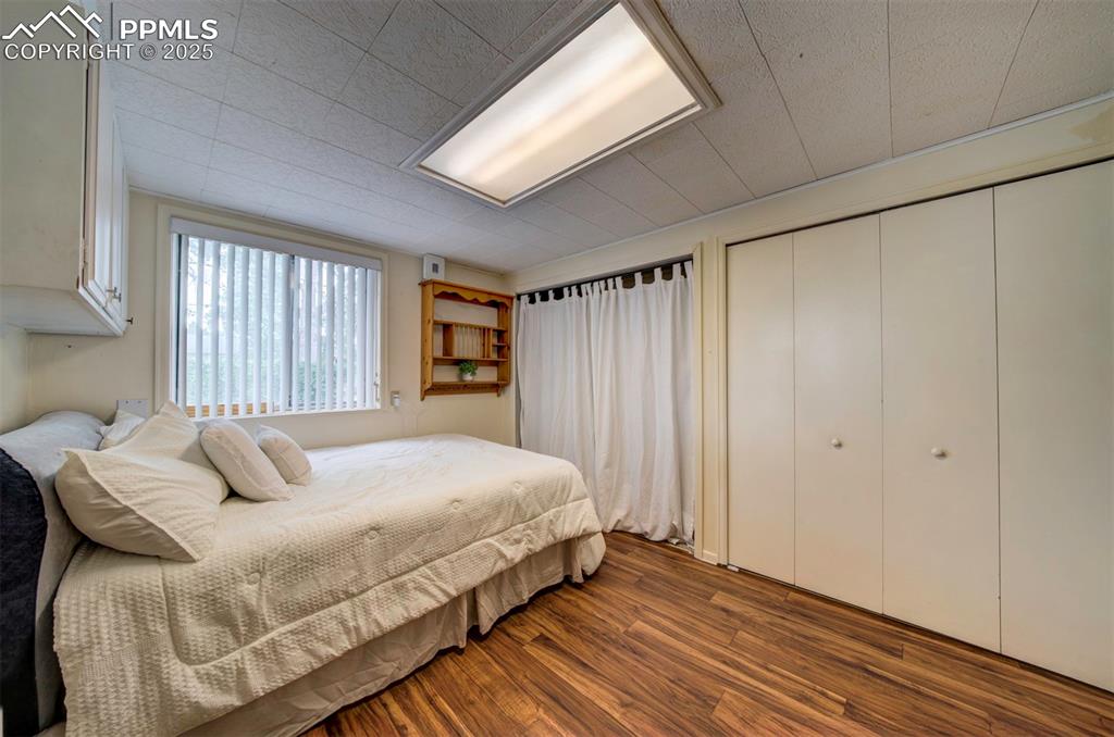 3710 Windflower Circle Colorado Springs, CO 80918 - Photo 26 of 32 a bedroom with a bed and a window