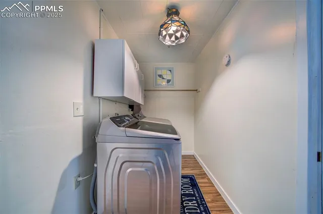a view of storage and utility room with washer and dryer