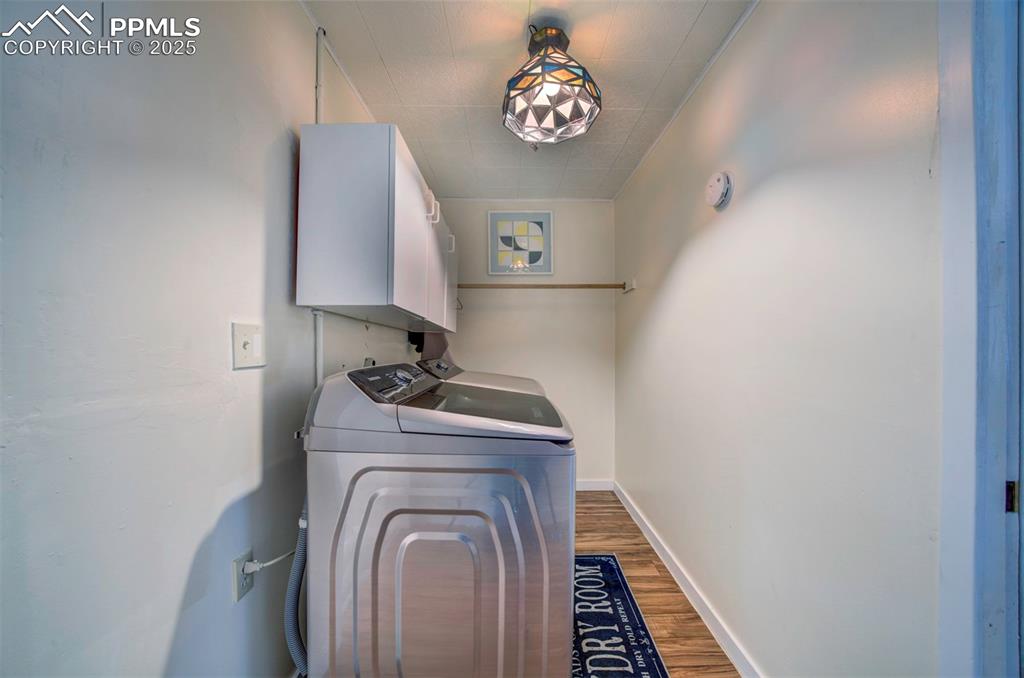 3710 Windflower Circle Colorado Springs, CO 80918 - Photo 27 of 32 a view of storage and utility room with washer and dryer