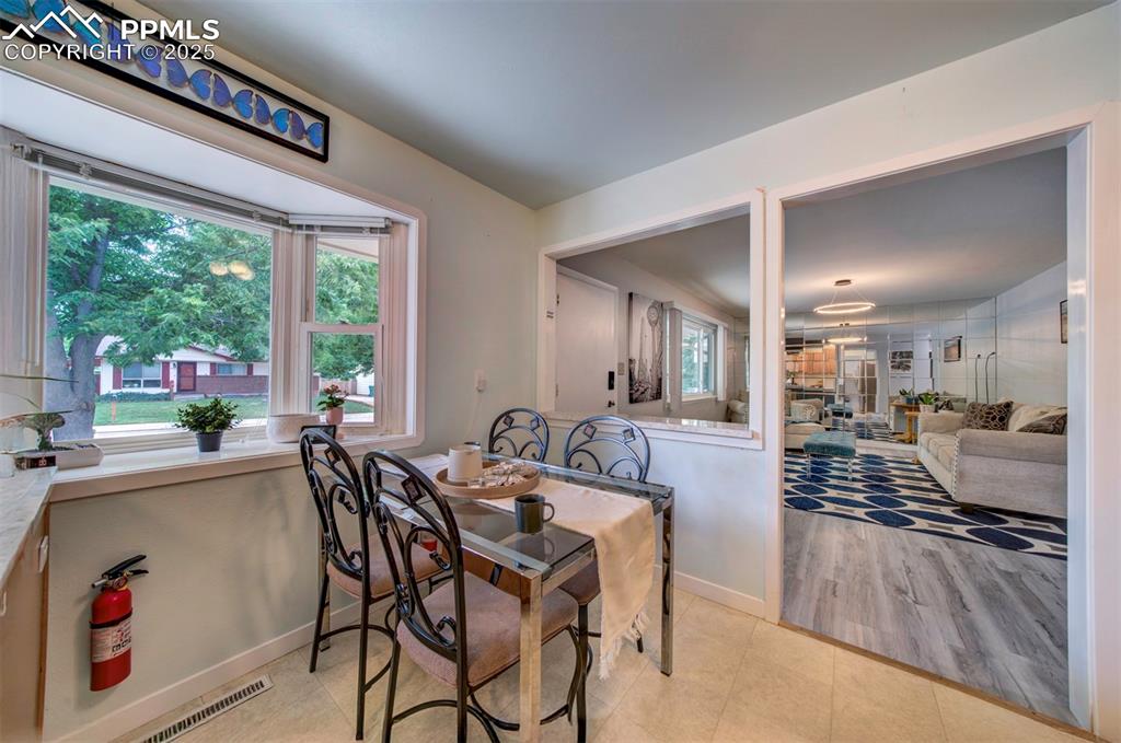 3710 Windflower Circle Colorado Springs, CO 80918 - Photo 7 of 32 a view of a dining hall with furniture and windows