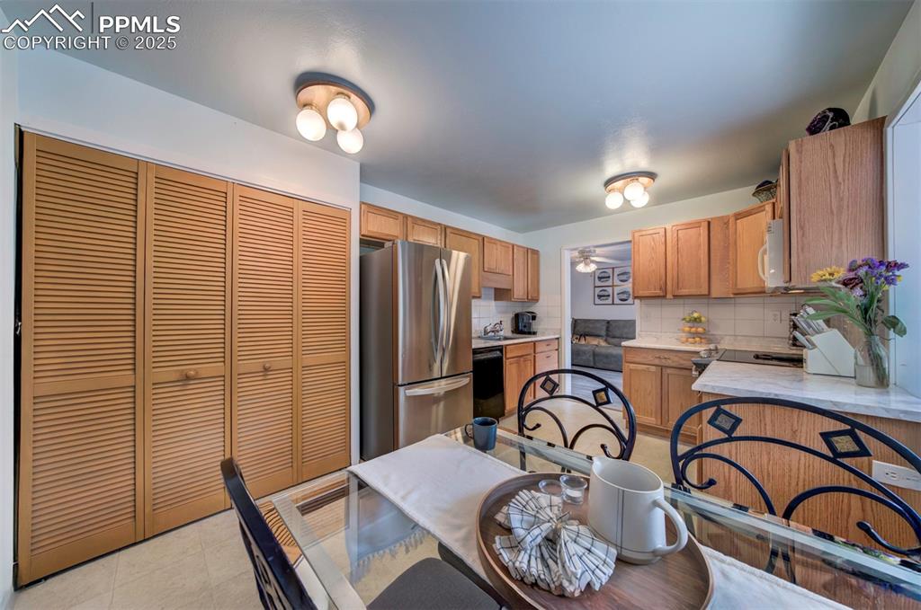 3710 Windflower Circle Colorado Springs, CO 80918 - Photo 8 of 32 a view of a a dining room with furniture window and wooden floor