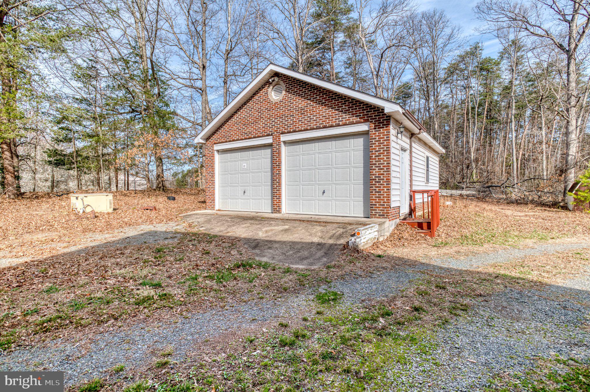 3220 Courtney School Road Midland, VA 22728 - Photo 71 of 111 Large garage with electric and woodstove