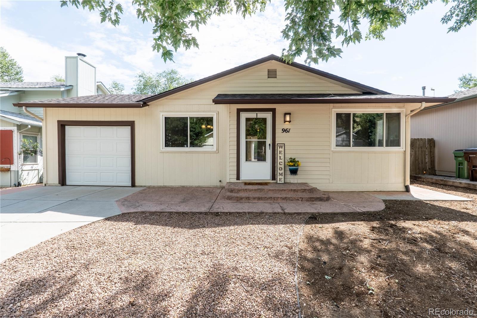 961 Columbine Avenue Colorado Springs, CO 80904 - Photo 2 of 47 a front view of a house with a yard