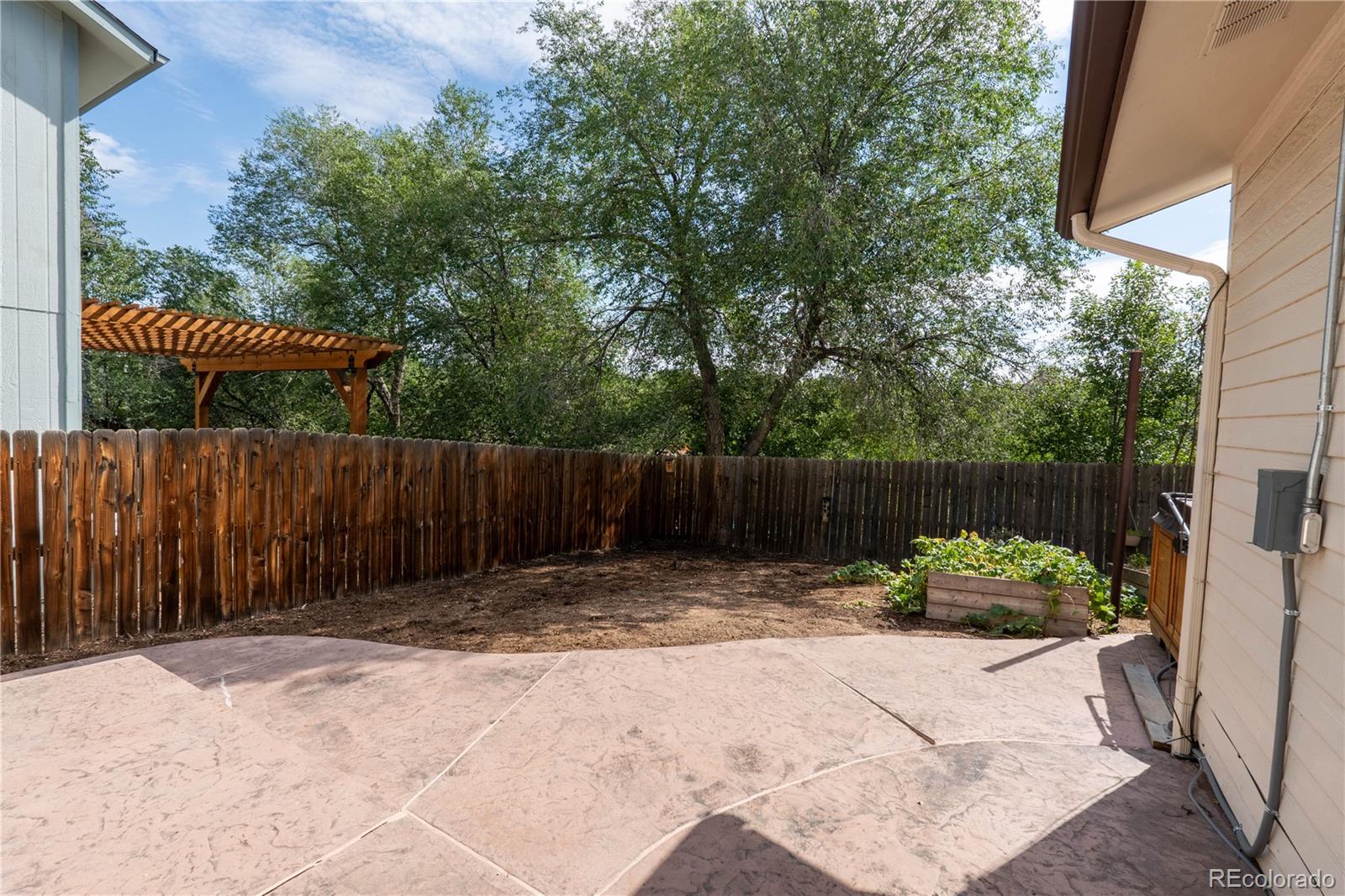 961 Columbine Avenue Colorado Springs, CO 80904 - Photo 32 of 47 a view of garden with wooden fence