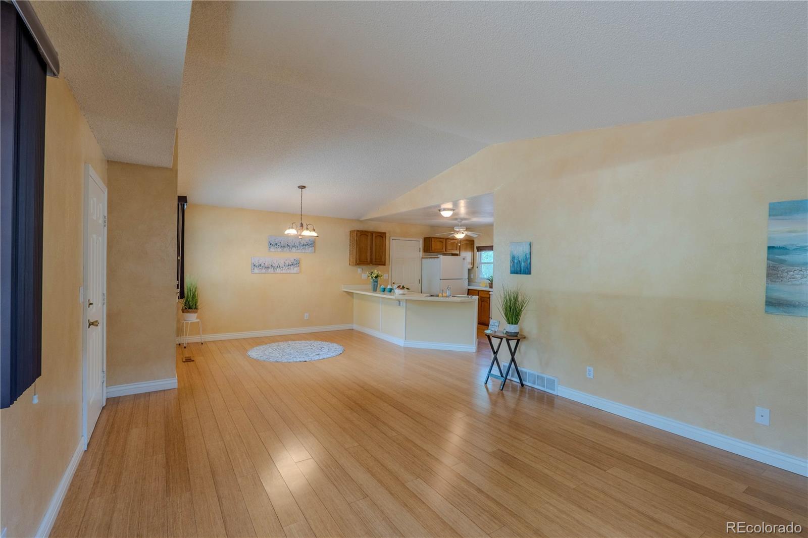 961 Columbine Avenue Colorado Springs, CO 80904 - Photo 7 of 47 a view of a room with wooden floor table and chairs