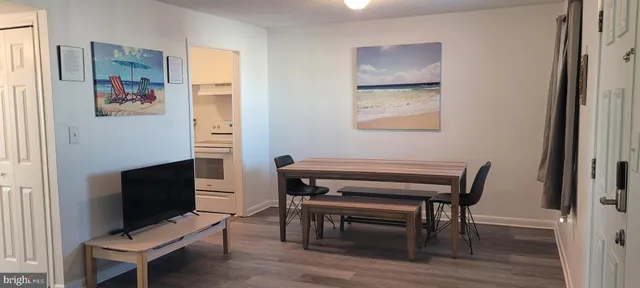 a room with furniture wall paintings and a window