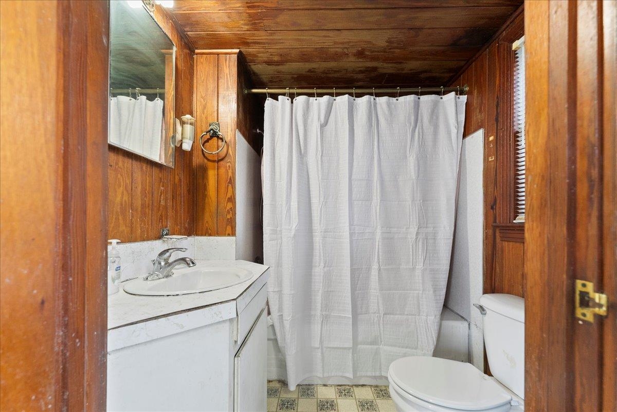 10 Clark Street St. Augustine, FL 32084 - Photo 20 of 44 a bathroom with a sink toilet and shower