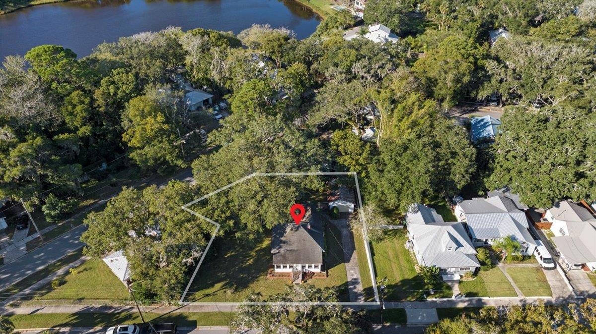 10 Clark Street St. Augustine, FL 32084 - Photo 2 of 44 an aerial view of a house with a yard and large trees