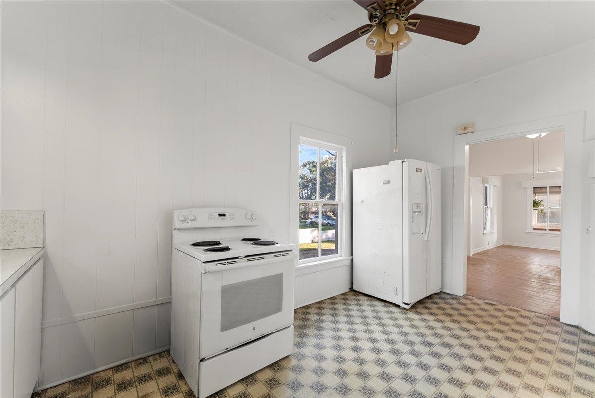 10 Clark Street St. Augustine, FL 32084 - Photo 23 of 44 a kitchen with a stove a refrigerator and a cabinets