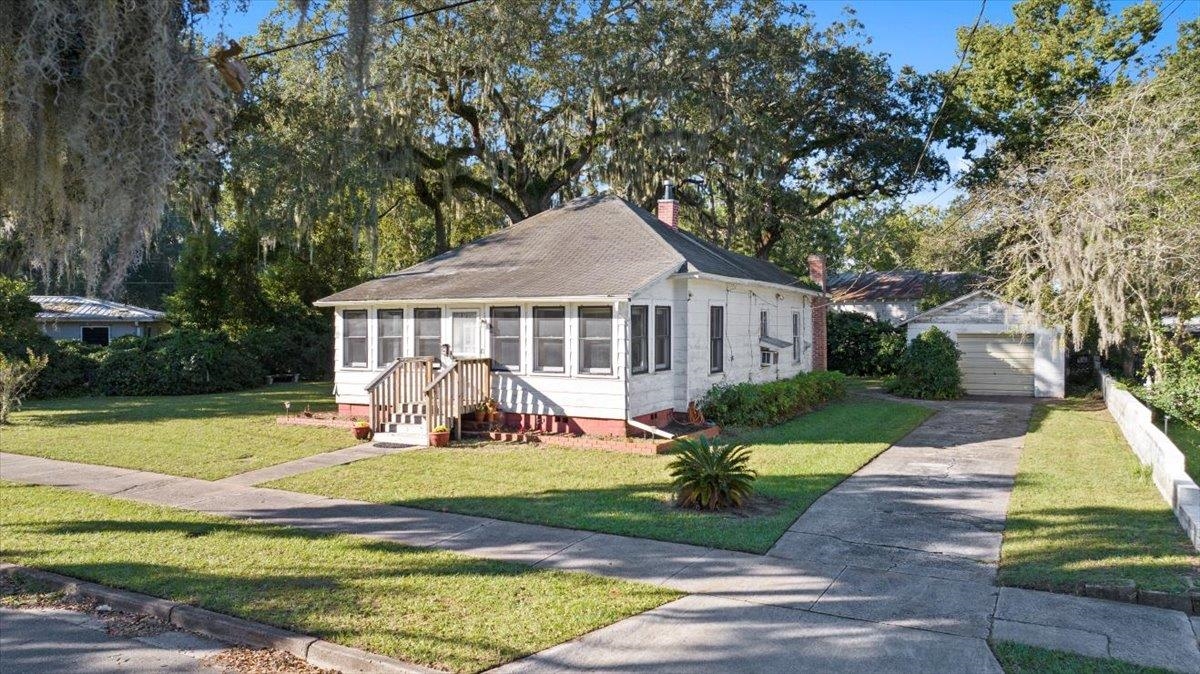 10 Clark Street St. Augustine, FL 32084 - Photo 28 of 44 a view of a house with a yard patio and a garden