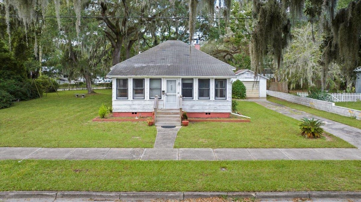 10 Clark Street St. Augustine, FL 32084 - Photo 43 of 44 a front view of a house with a yard