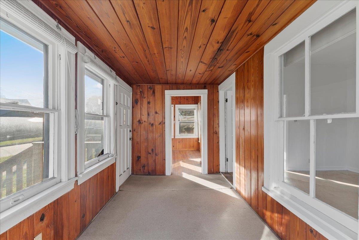 10 Clark Street St. Augustine, FL 32084 - Photo 7 of 44 a view of a porch with wooden floor and windows