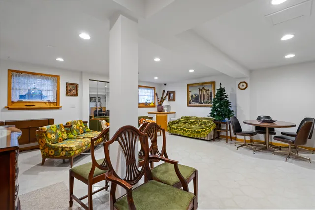 a living room with furniture and a gym