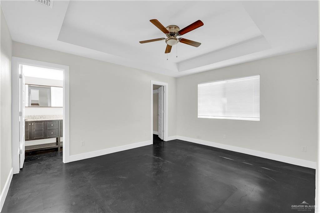 308 North 17th Street, Unit B McAllen, TX 78501 - Photo 13 of 19 wooden floor in an empty room with a window