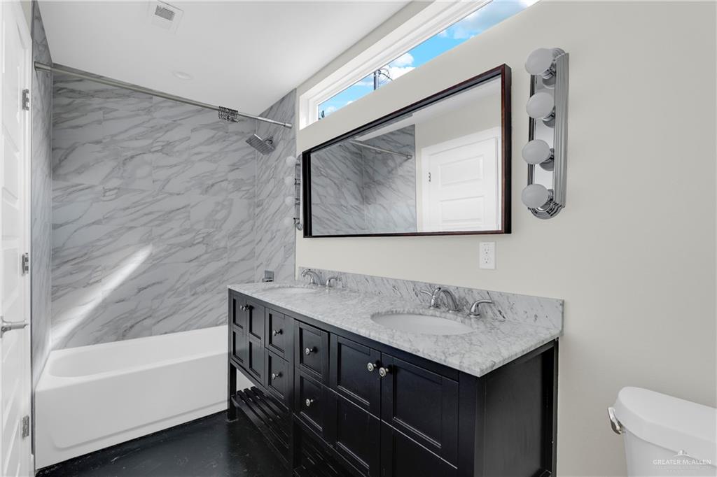 308 North 17th Street, Unit B McAllen, TX 78501 - Photo 14 of 19 a bathroom with a tub sink and mirror
