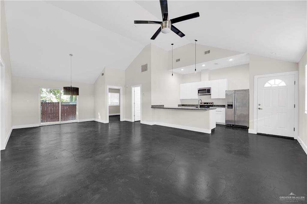 308 North 17th Street, Unit B McAllen, TX 78501 - Photo 4 of 19 a view of kitchen with stove and wooden floor