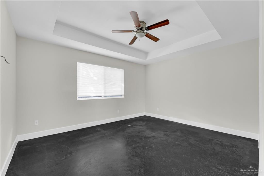 308 North 17th Street, Unit B McAllen, TX 78501 - Photo 10 of 19 an empty room with a window