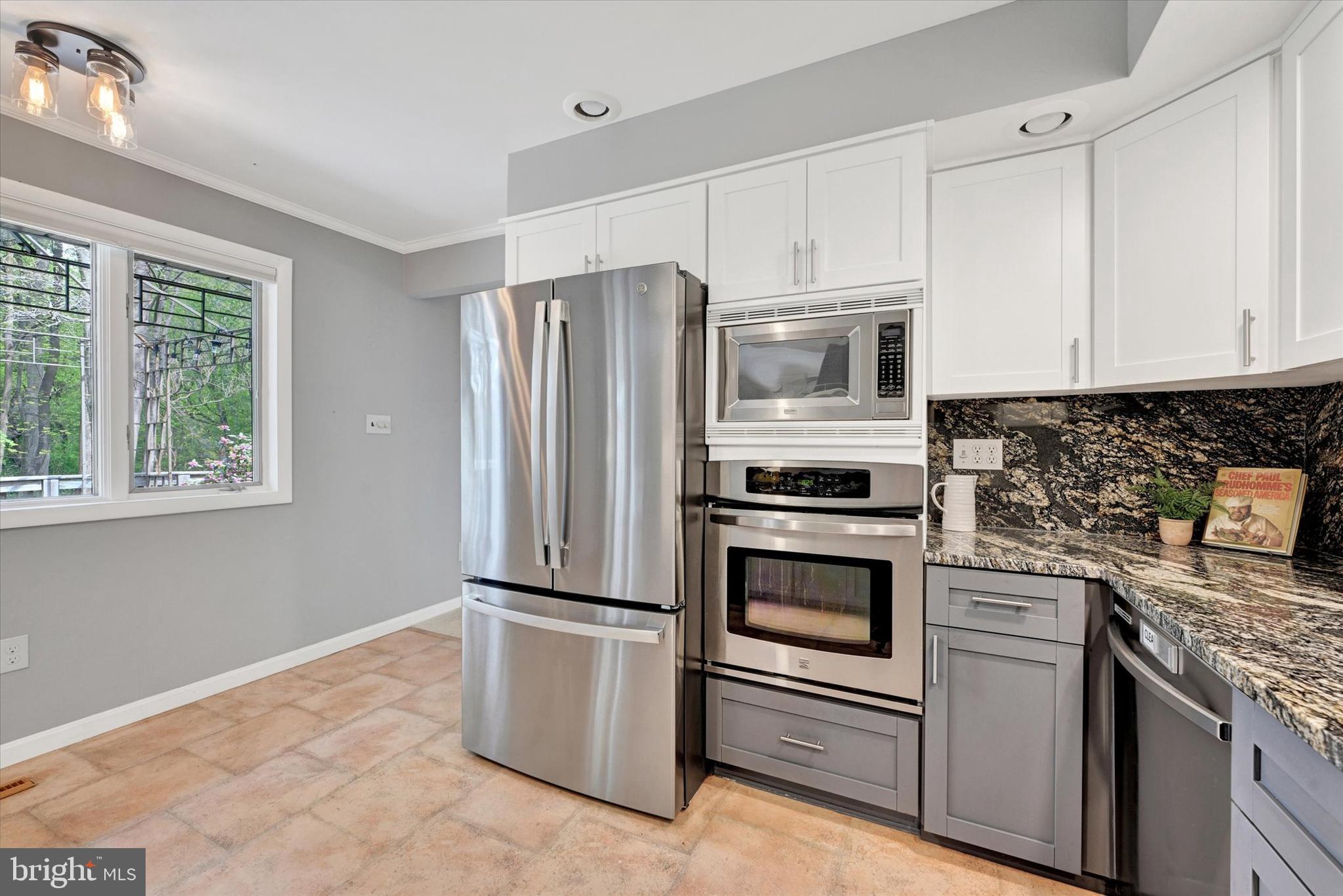 6 Drew Court Baldwin, MD 21013 - Photo 14 of 39 a kitchen with granite countertop white cabinets and stainless steel appliances