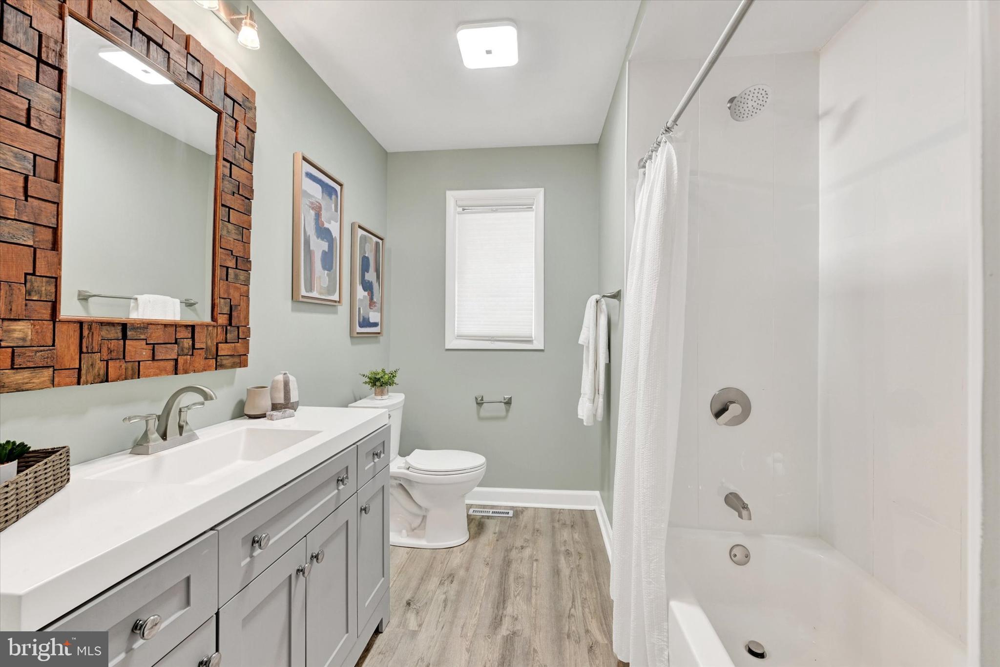 6 Drew Court Baldwin, MD 21013 - Photo 18 of 39 a bathroom with a sink a toilet and shower