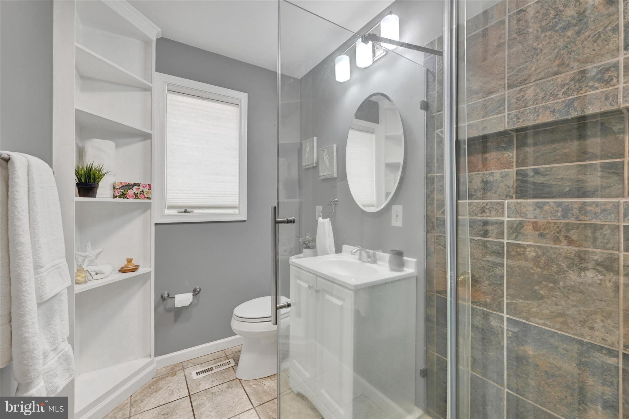 6 Drew Court Baldwin, MD 21013 - Photo 23 of 39 a bathroom with a sink a toilet and a mirror