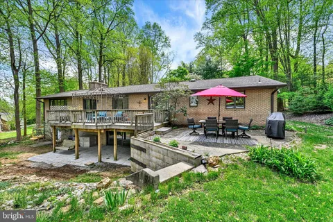 a view of a chairs and table in the balcony