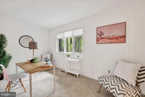 a living room with furniture and window