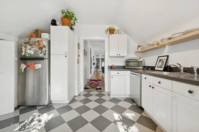 a kitchen with stainless steel appliances and cabinets