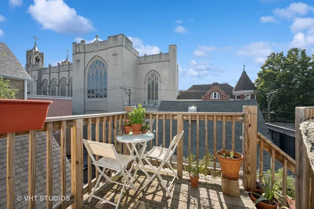 a bedroom with furniture and a flat screen tv