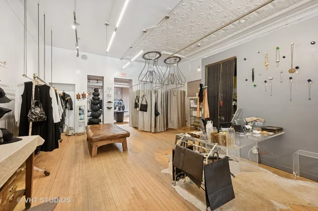 a living room with lots of furniture and gym equipment