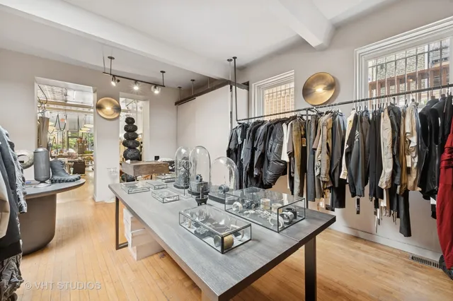 a living room with lots of furniture and a wooden floor