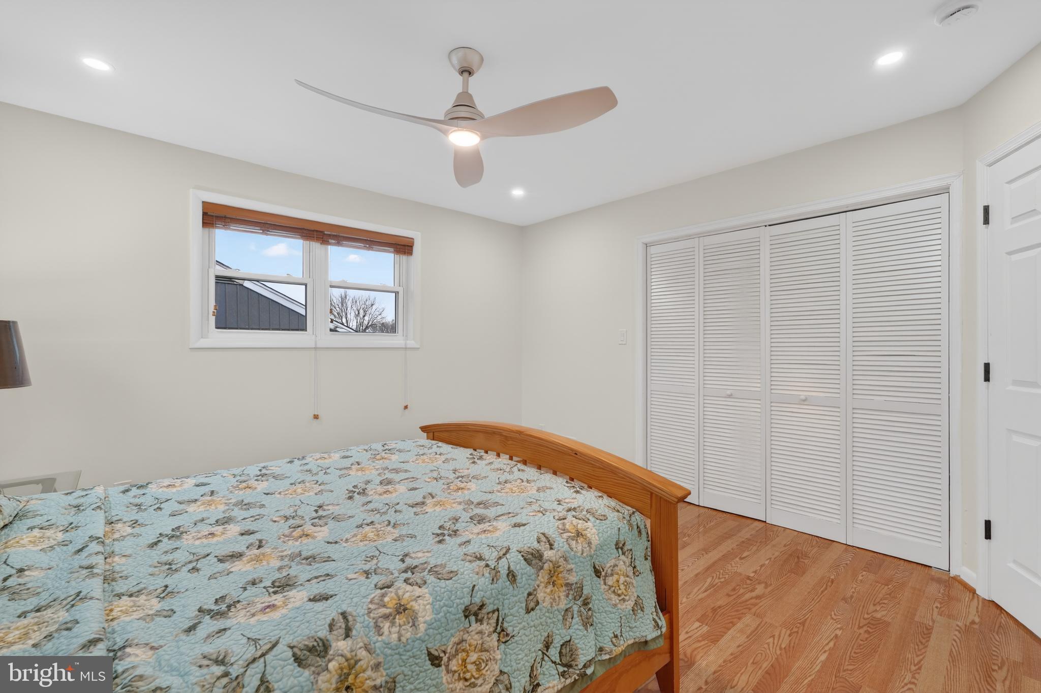 1132 Loxford Terrace Silver Spring, MD 20901 - Photo 14 of 30 a bedroom with a bed and a window