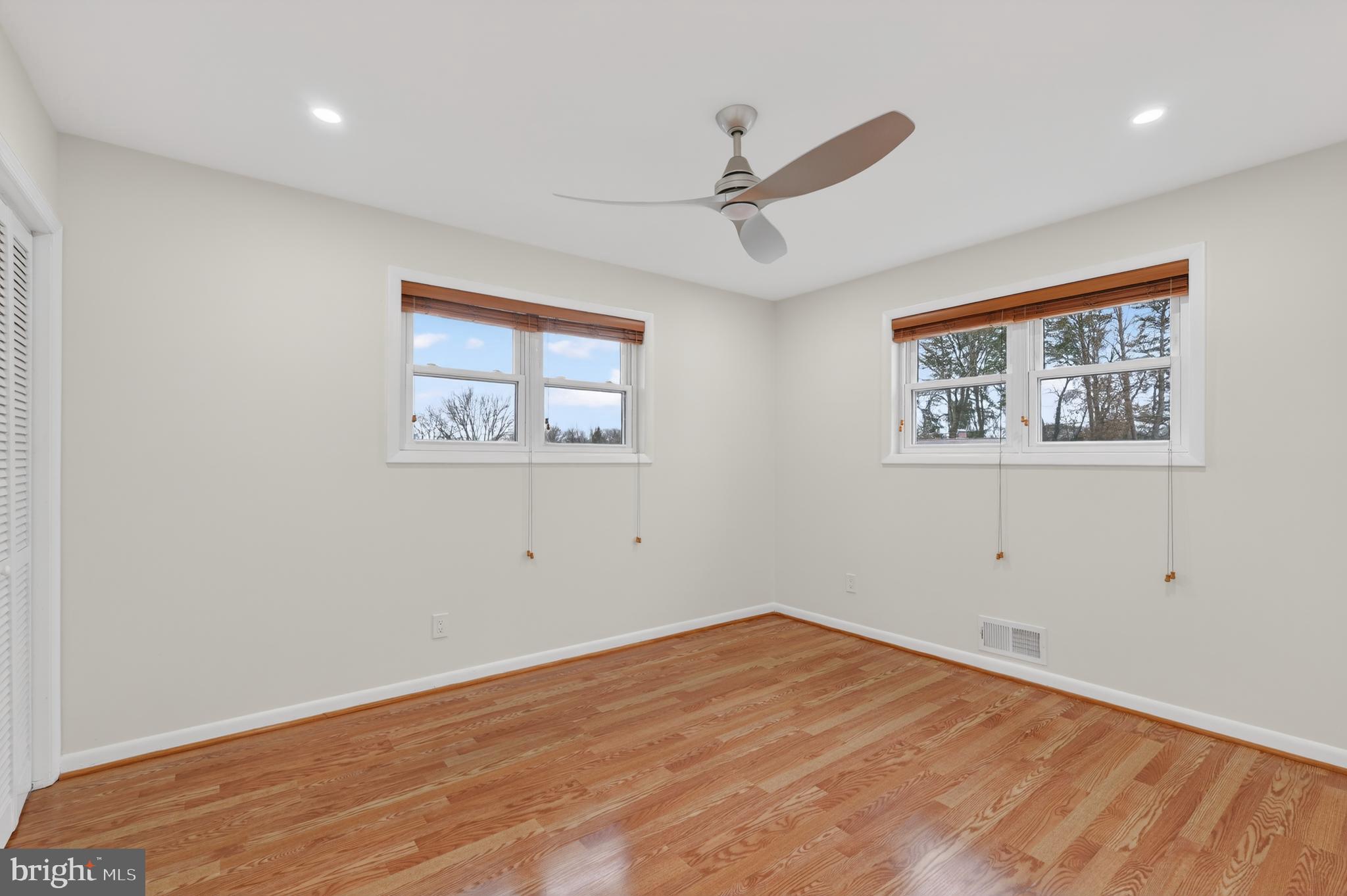 1132 Loxford Terrace Silver Spring, MD 20901 - Photo 15 of 30 a view of empty room with wooden floor