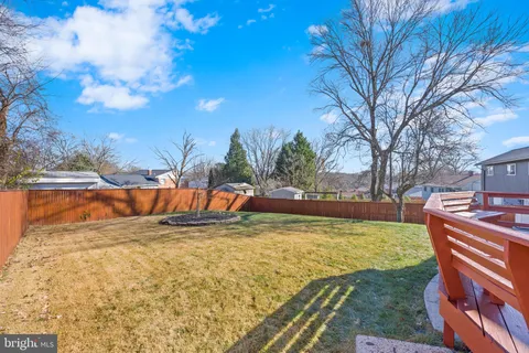 a view of a swimming pool with an outdoor space and seating area