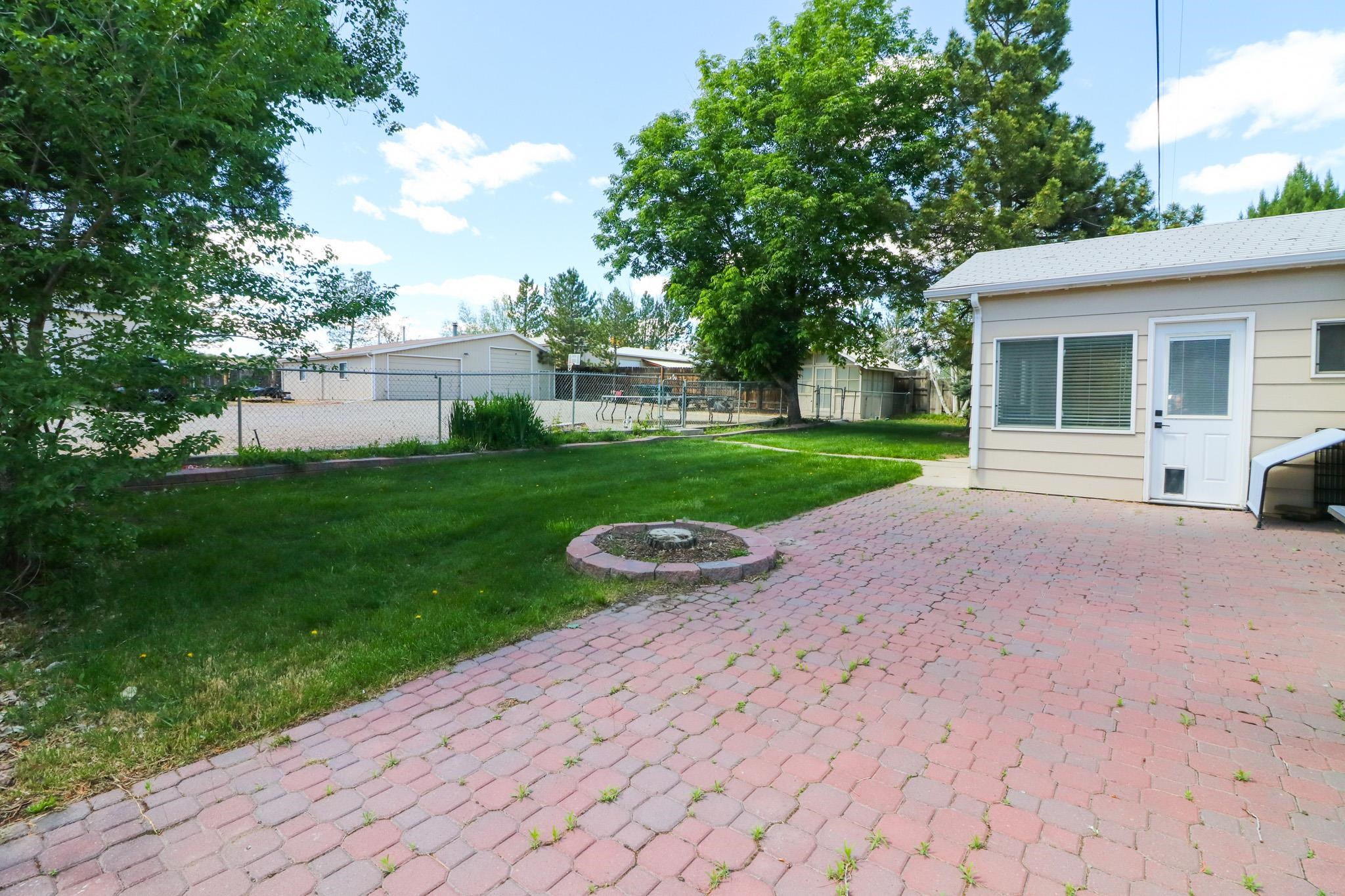 607-28 28 3/4 Road Grand Junction, CO 81506 - Photo 24 of 42 a view of a house with backyard and garden