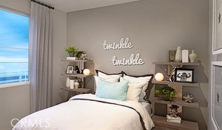 8788 Newcastle Avenue Hesperia, CA 92344 - Photo 5 of 6 a bedroom with a bed and a table