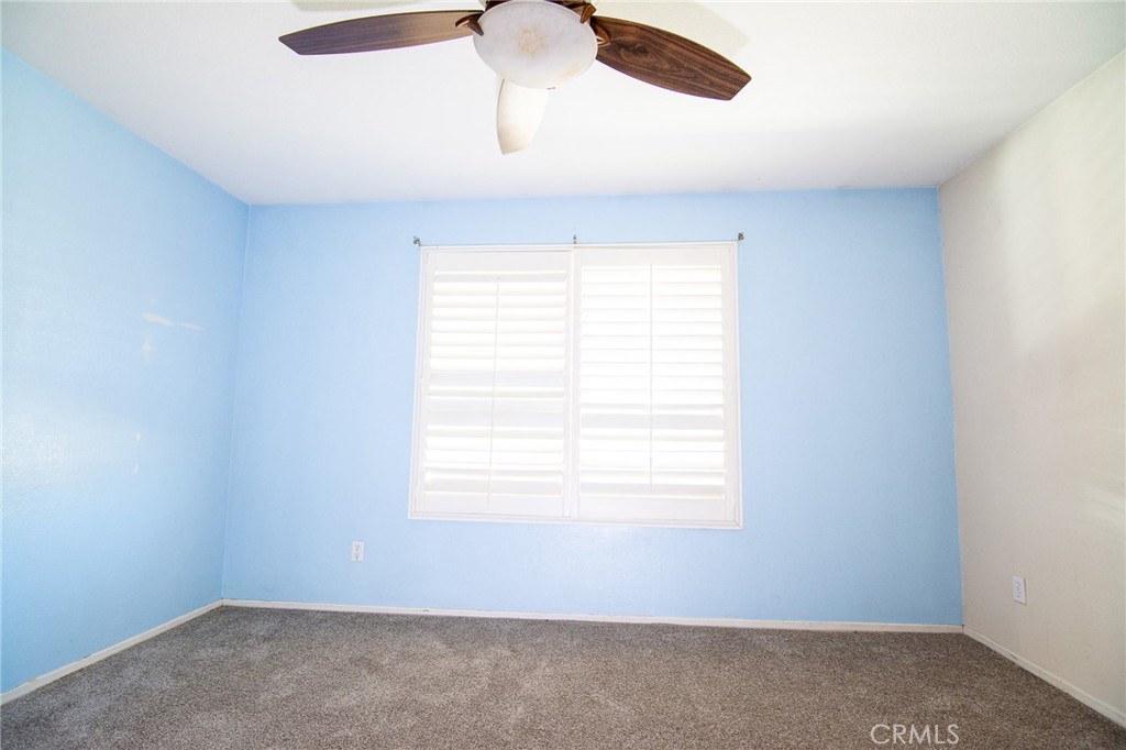 15036 Carrolton Street Adelanto, CA 92301 - Photo 18 of 23 an empty room with a window