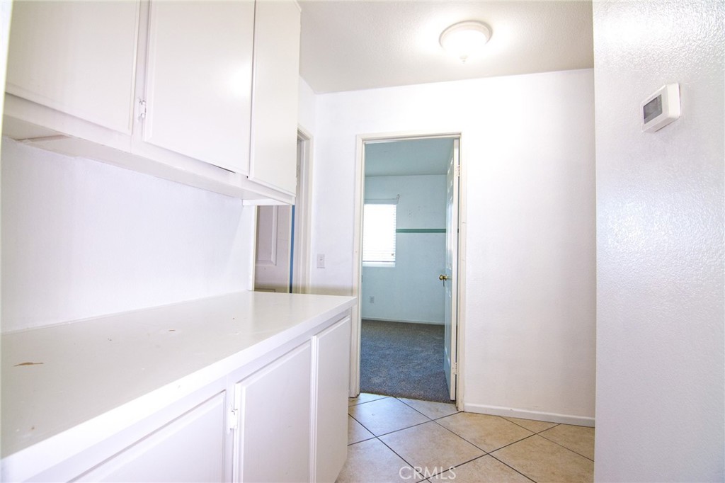 15036 Carrolton Street Adelanto, CA 92301 - Photo 21 of 23 a bathroom with a sink and a mirror