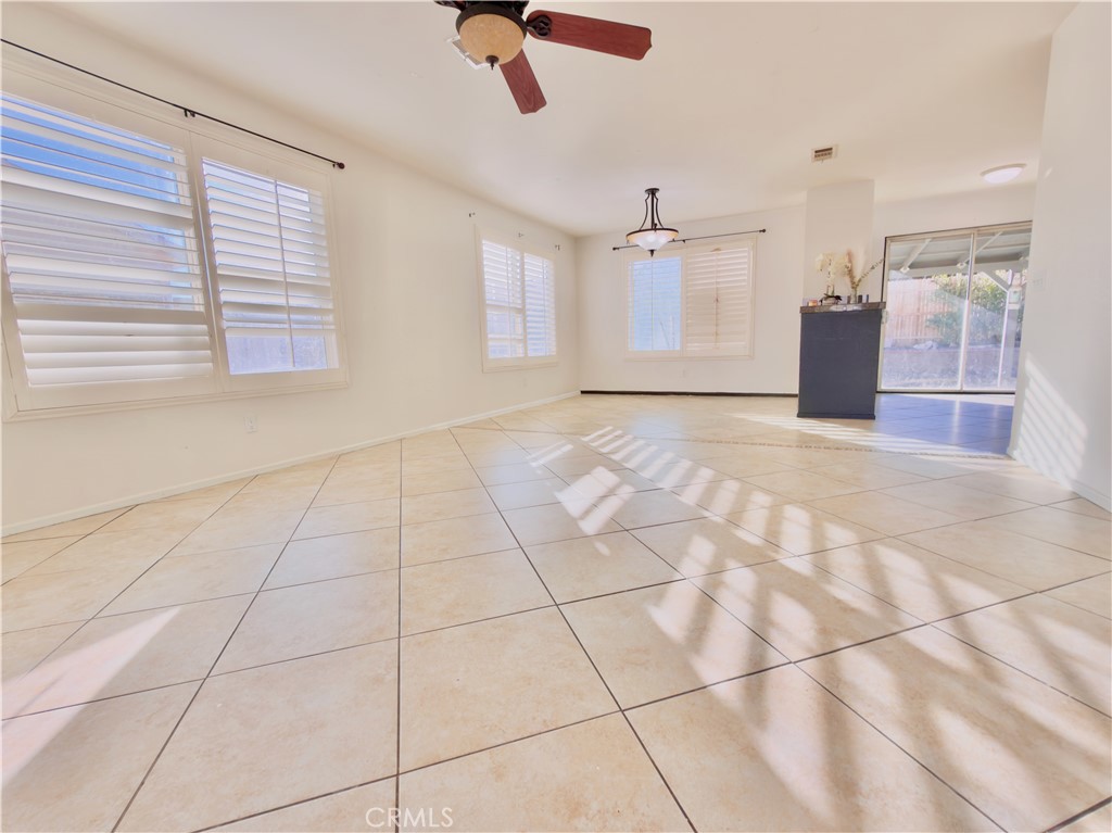 15036 Carrolton Street Adelanto, CA 92301 - Photo 4 of 23 a view of an empty room with a window