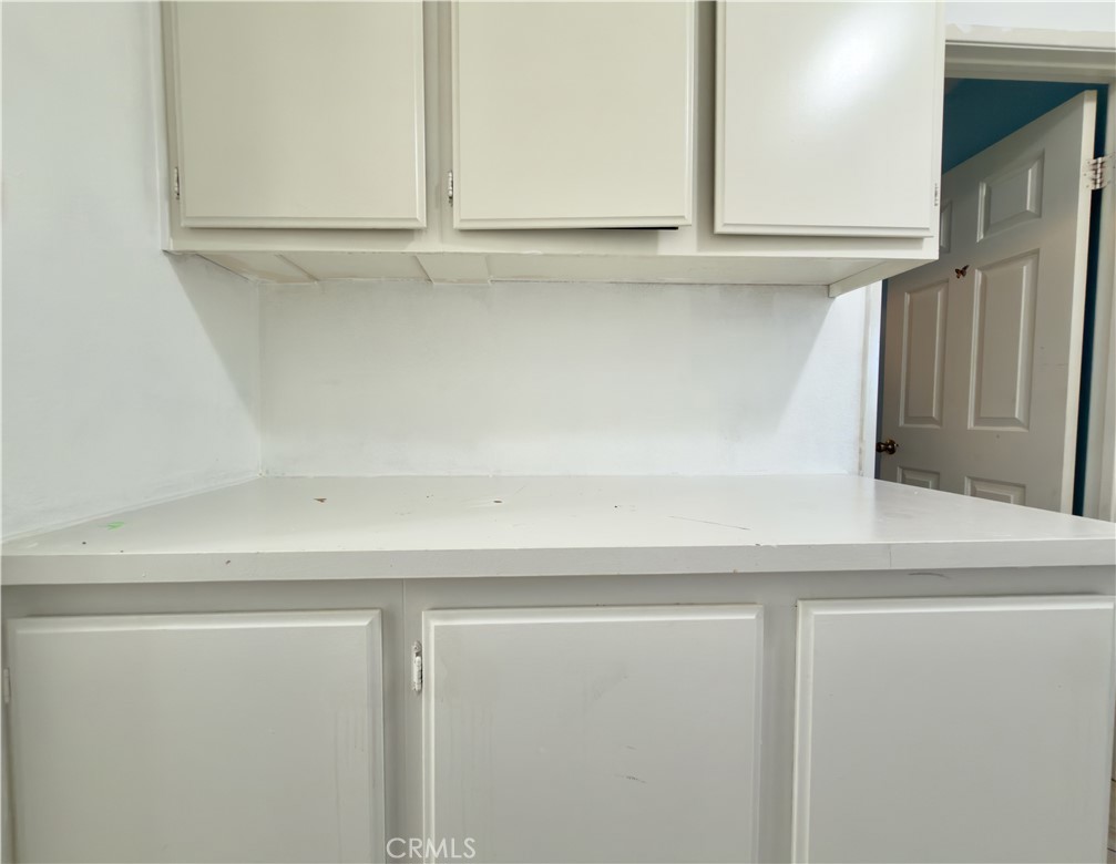 15036 Carrolton Street Adelanto, CA 92301 - Photo 7 of 23 a close view of wooden cabinets
