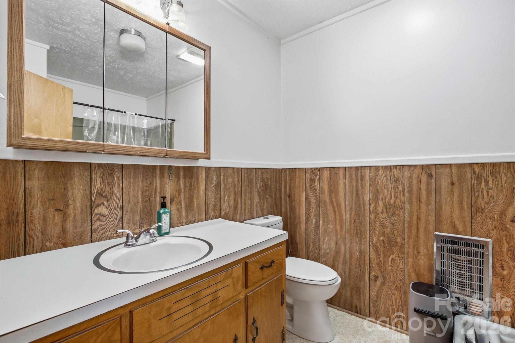 3266 Coble Dairy Road Hudson, NC 28638 - Photo 17 of 37 a bathroom with a sink and a toilet