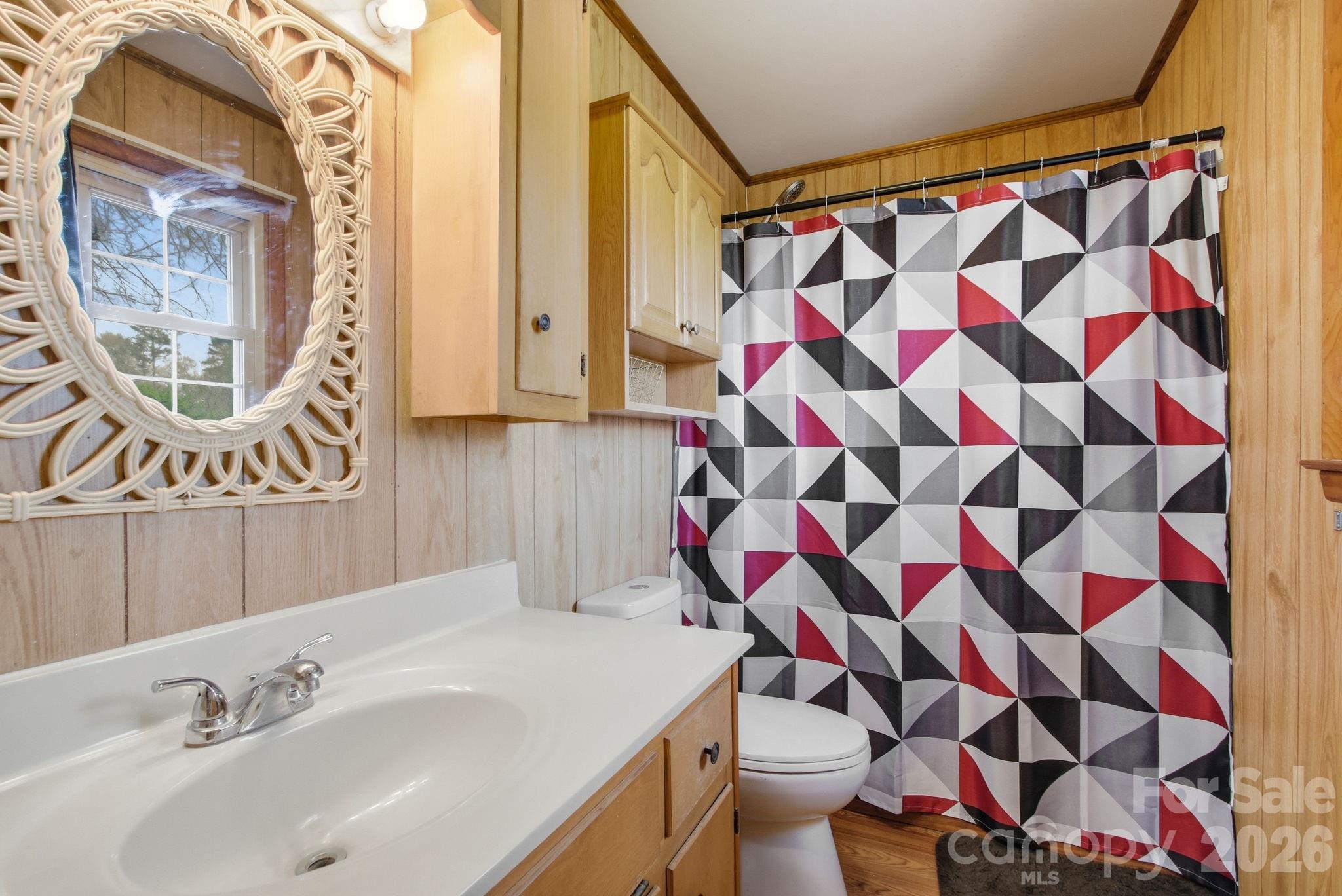 3266 Coble Dairy Road Hudson, NC 28638 - Photo 24 of 37 a bathroom with a sink and a mirror
