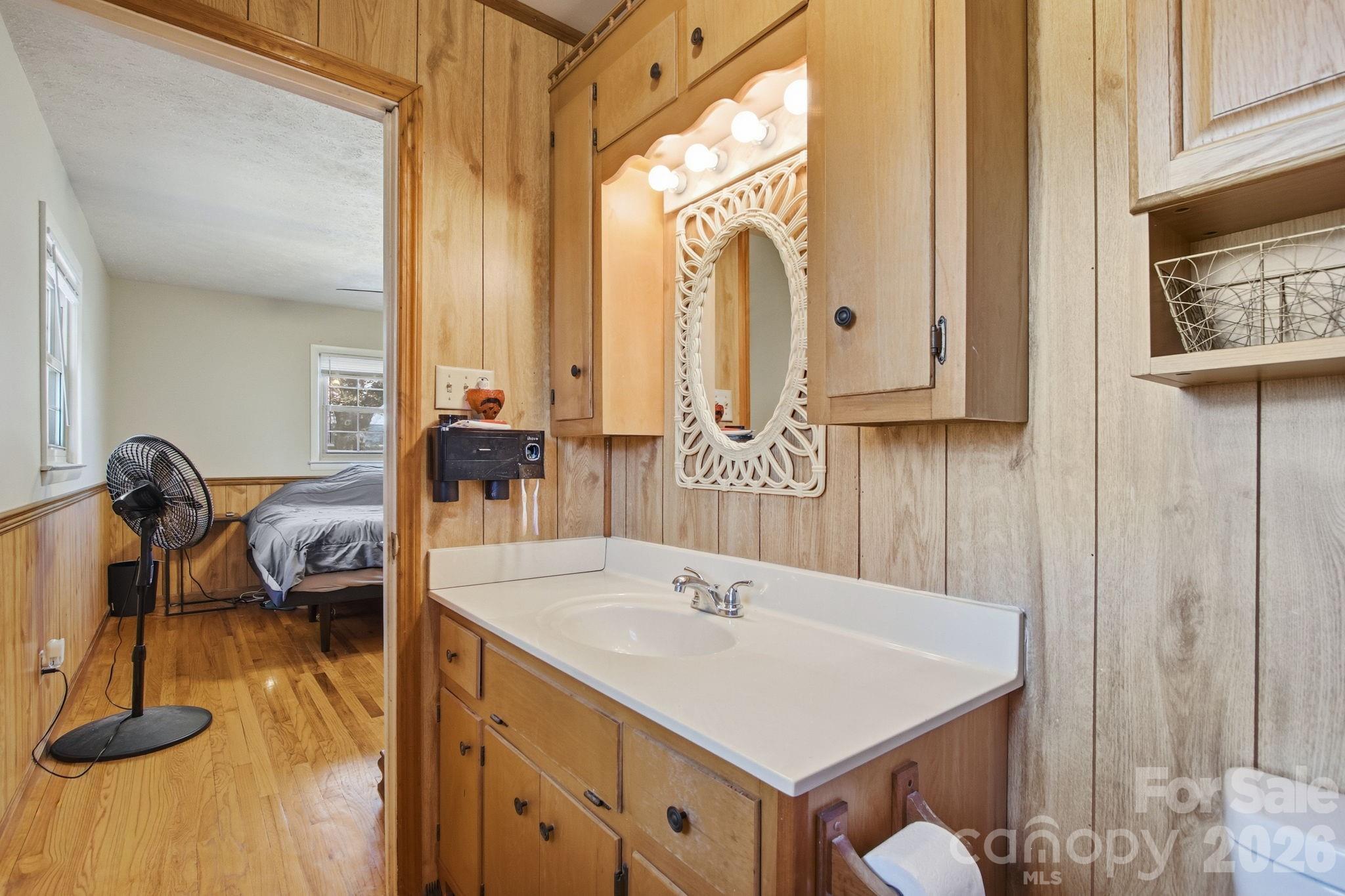3266 Coble Dairy Road Hudson, NC 28638 - Photo 25 of 37 a view of a kitchen area with furniture and floor to ceiling windows